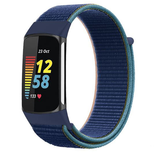 Deep navy blue fitbit charge 5 nylon strap close view
